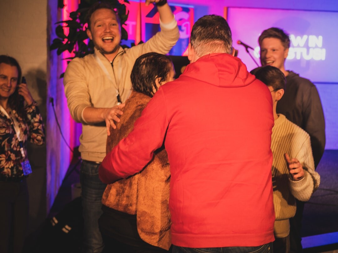 Guests mingling and laughing at an evening red carpet event