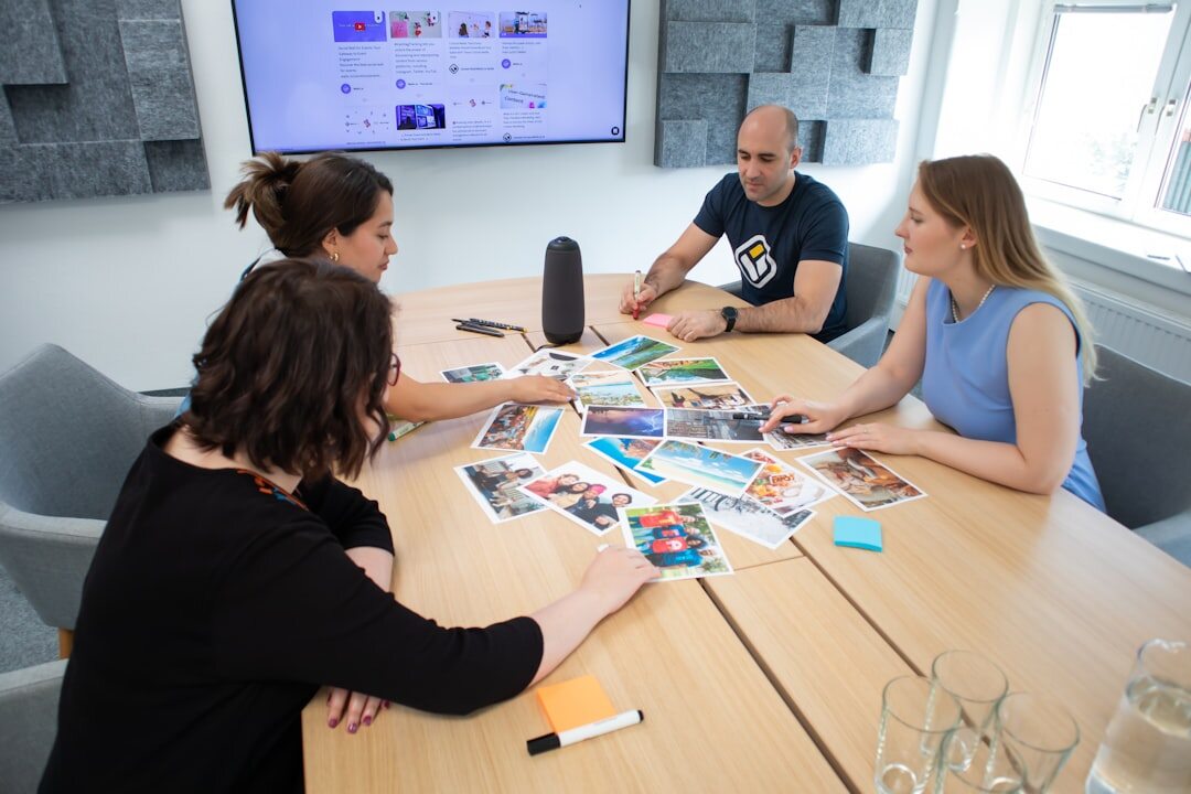Editorial team having a discussion around a table