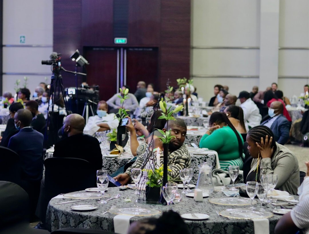 Crowd of guests applauding at an evening gala