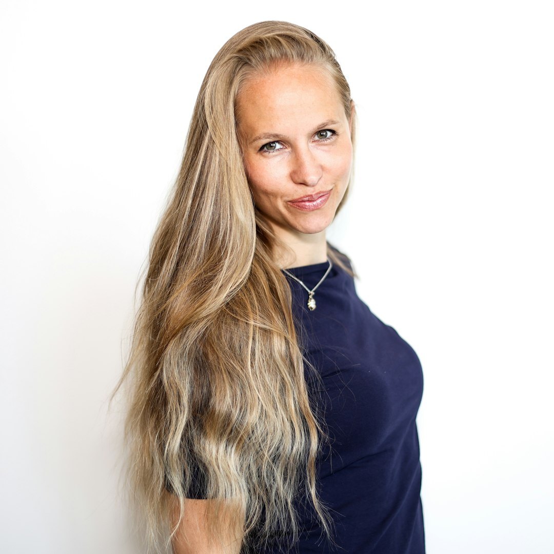 Studio portrait of a smiling Croatian woman editor